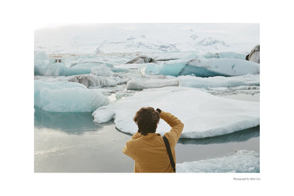 Corey Wolfenberger taking a photo of icebergs