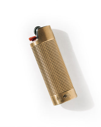 editorial image of The Lighter Sleeve in Brass flatlay