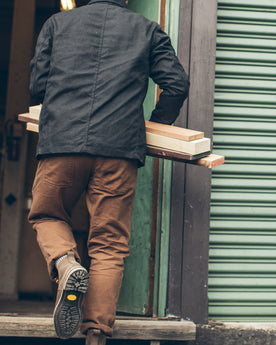 Our fit model working on his truck, Pants by Taylor Stitch
