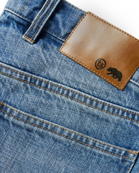 material shot of the leather patch on The Slim Jean in Patch Wash Selvage, Bottoms by Taylor Stitch
