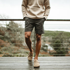 fit model wearing The Morse Short in Dark Slate Linen on a deck