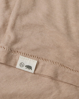 material shot of the hem logo of The Cotton Hemp Tee in Khaki, Knits by Taylor Stitch