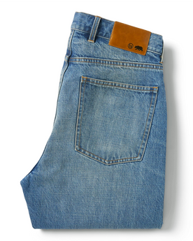 flatlay of The Slim Jean in Patch Wash Selvage, folded from the back, Bottoms by Taylor Stitch