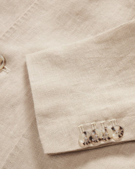 material shot of the light horn buttons on The Sheffield Sport Coat in Natural Linen, Outerwear by Taylor Stitch