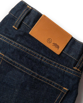 material shot of leather patch of The Democratic Jean in Rinsed Organic Selvage, Bottoms by Taylor Stitch