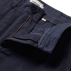 material shot of The Slim Foundation Pant in Dark Navy with an open fly