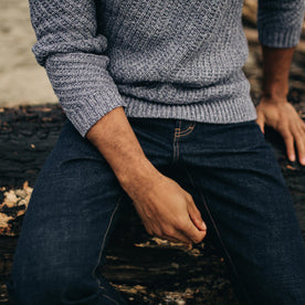 fit model wearing a sweater and The Slim Jean in Rinsed Organic Selvage