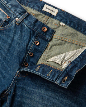 material shot of front open button fly of The Slim Jean in Sawyer Wash Organic Selvage, Bottoms by Taylor Stitch