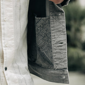 fit model showing the inside pocket in The Long Haul Jacket in Steeple Grey Cord