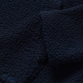 material shot of the sleeve of The Nomad Hoodie in Navy Sherpa