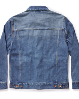 flatlay of The Ryder Jacket in Sun Bleached Denim, shown from the back, Outerwear by Taylor Stitch
