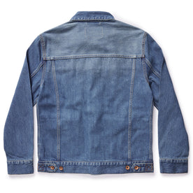 flatlay of The Ryder Jacket in Sun Bleached Denim, shown from the back