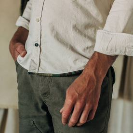 fit model wearing The Atelier and Repairs Jack in Washed White Oxford, hand at side