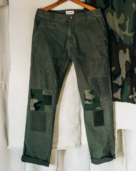 material shot of The Atelier and Repairs Chino in Olive, on hanger, Bottoms by Taylor Stitch