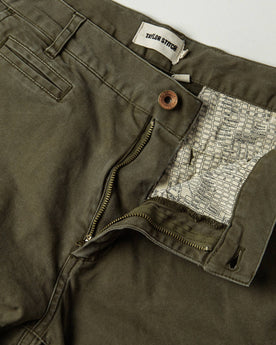 material shot of The Atelier and Repairs Chino in Olive, fly shot, Bottoms by Taylor Stitch
