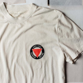 material shot of the graphic logo on The Cotton Hemp Tee in Hate-Free