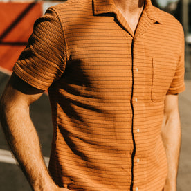 fit model showing the front of The Short Sleeve Hawthorne in Rust Pickstitch Waffle