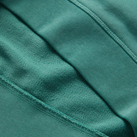 material shot of the ribbed hem on The Fillmore Crewneck in Teal