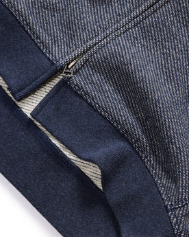 material shot of the ribbed hem on The Apres Zip Hoodie in Heather Navy Terry, Knits by Taylor Stitch