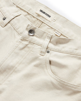 material shot of the button fly on The Democratic All Day Pant in Dune Canvas, Bottoms by Taylor Stitch