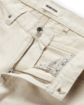 material shot of the button fly undone on The Democratic All Day Pant in Dune Canvas, Bottoms by Taylor Stitch