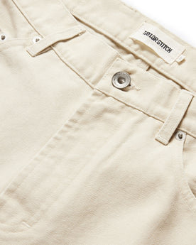 material shot of the button fly on The Slim All Day Pant in Dune Canvas, Bottoms by Taylor Stitch