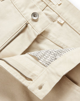 material shot of the button fly undone on The Slim All Day Pant in Dune Canvas, Bottoms by Taylor Stitch