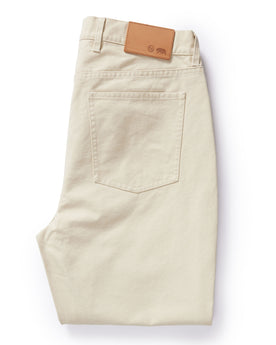 flatlay of The Slim All Day Pant in Dune Canvas, shown folded from back, Bottoms by Taylor Stitch