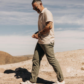 fit model walking in the desert in The Slim All Day Pant in Arid Eucalyptus Canvas