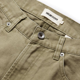 material shot of the button fly on The Slim All Day Pant in Arid Eucalyptus Canvas