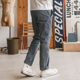 fit model showing the back of The Morse Pant in Washed Indigo Stripe