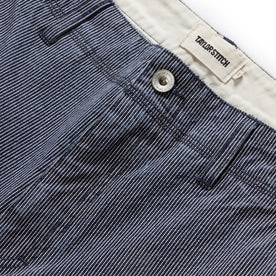 material shot of the button fly on The Morse Pant in Washed Indigo Stripe