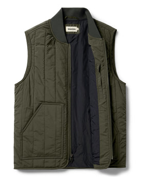 flatlay of The Able Vest in Quilted Army, shown zipped open, Outerwear by Taylor Stitch