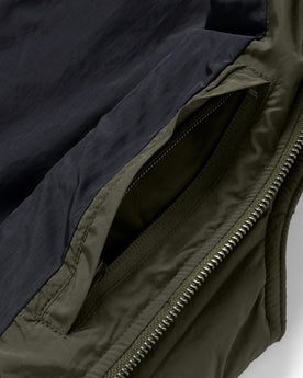 material shot of the interior pocket on The Able Vest in Quilted Army, Outerwear by Taylor Stitch