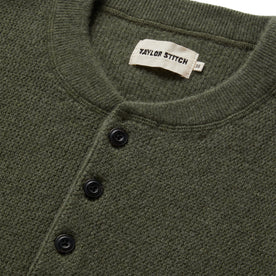 material shot of the buttons on The Hudson Sweater in Heather Green