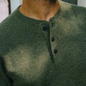 fit model showing button detail on The Hudson Sweater in Heather Green