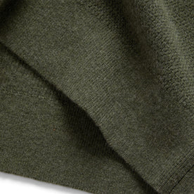 material shot of the hem on The Hudson Sweater in Heather Green