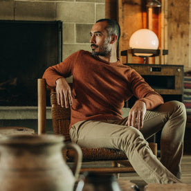 fit model posing in The Lodge Sweater in Rust