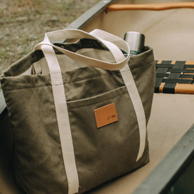 flatlay of The Market Tote in Stone Boss Duck outdoors