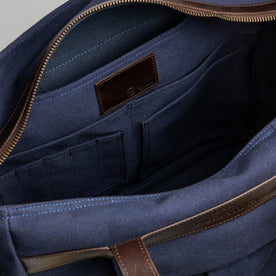 material shot of the internal pockets and pen holder compartments of The Utility Bag in Navy