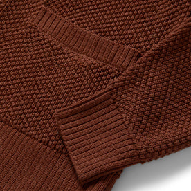 material shot of the ribbed cuffs on The Crawford Sweater in Rust
