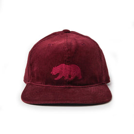 flatlay of The Ball Cap in Burgundy Cord