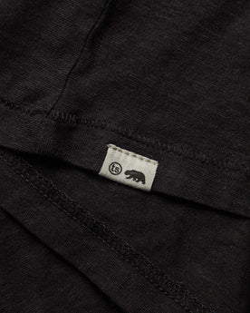 material shot of ts logo, Knits by Taylor Stitch