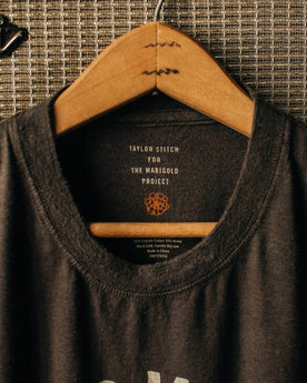 material shot of The Cotton Hemp Tee in Flower Power hanging up on a speaker, Knits by Taylor Stitch