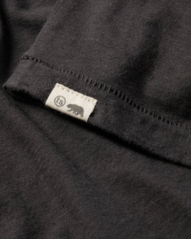 material shot of The Cotton Hemp Tee in Flower Power showing the sewn in front tag, Knits by Taylor Stitch