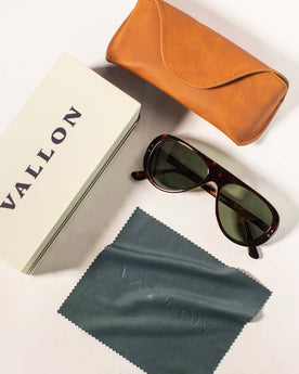 The Surf Aviator in Dark Tortoise, studio shot of box, cleaning microfiber towel, and case, Accessories by Taylor Stitch