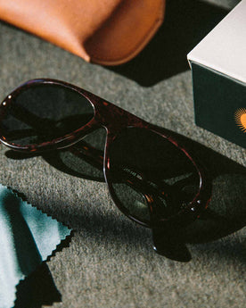 material shot of The Surf Aviator in Dark Tortoise next to box, Accessories by Taylor Stitch
