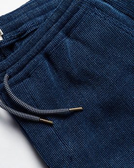 material shot of the drawstrings on The Apres Pant in Indigo Waffle, Bottoms by Taylor Stitch