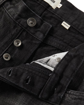 material shot of the button-fly on The Democratic Jean in Black 3-Month Wash Selvage, Bottoms by Taylor Stitch