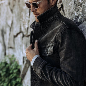 fit model with collar popped wearing The Long Haul Jacket in Black 3-Month Wash Selvage